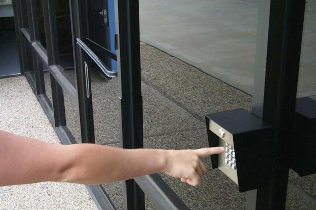 person pressing in numbers on a keypad