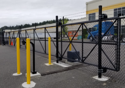 black electric fence enclosing a commercial property