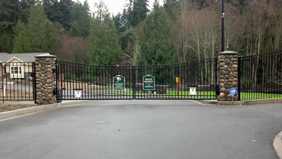 Double swing iron gate outside of an HOA community